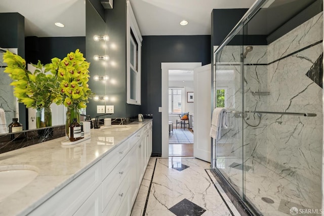 1123 Greenwich St, San Francisco, CA 94109 - full bathroom with marble tiled floors, double vanity, a marble finish shower, and recessed lighting
