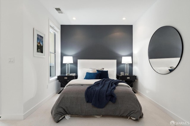 bedroom with light colored carpet