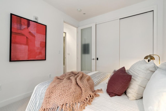 bedroom with a closet and carpet