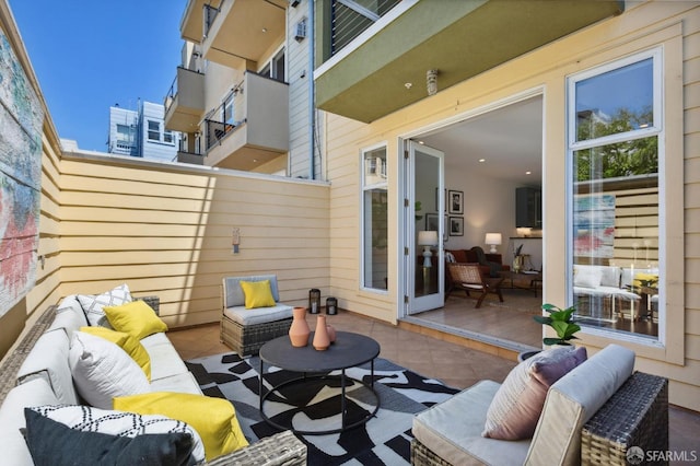 view of patio featuring a balcony