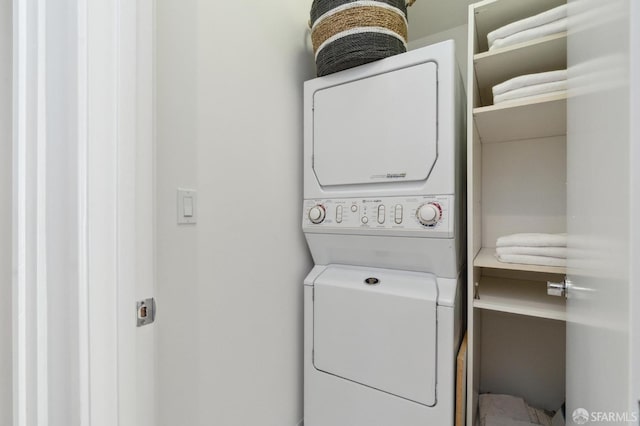 laundry area with stacked washer and dryer