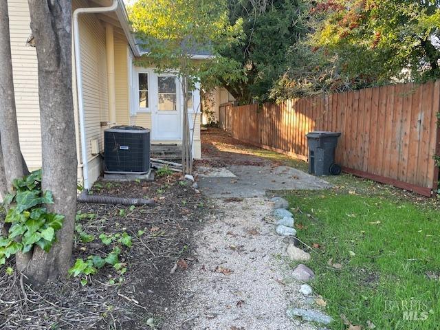 view of yard with central AC unit