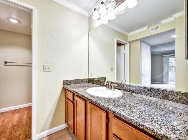 605 Canyon Oaks Dr Unit B, Oakland, CA 94605 - bathroom with vanity, ornamental molding, wood finished floors, and a textured wall