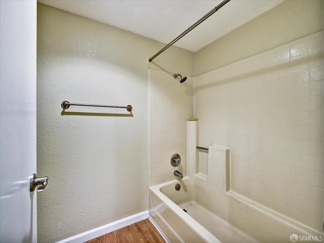 605 Canyon Oaks Dr Unit B, Oakland, CA 94605 - full bath with wood finished floors, shower / tub combination, and a textured wall