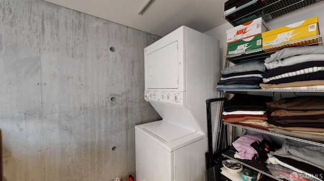 washroom with stacked washer and clothes dryer