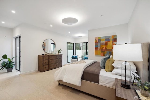 bedroom featuring light carpet