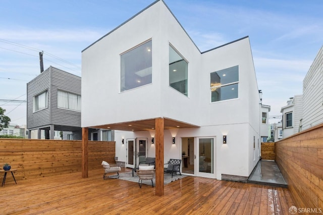 back of house featuring outdoor lounge area