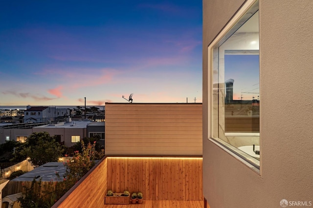 view of balcony at dusk