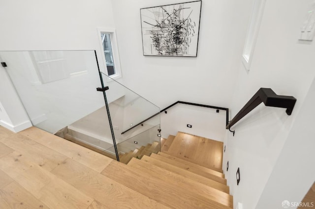 stairway featuring hardwood / wood-style flooring