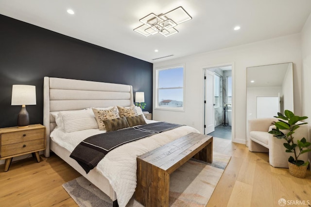 bedroom with light hardwood / wood-style floors