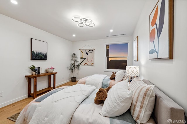 bedroom with light wood-type flooring