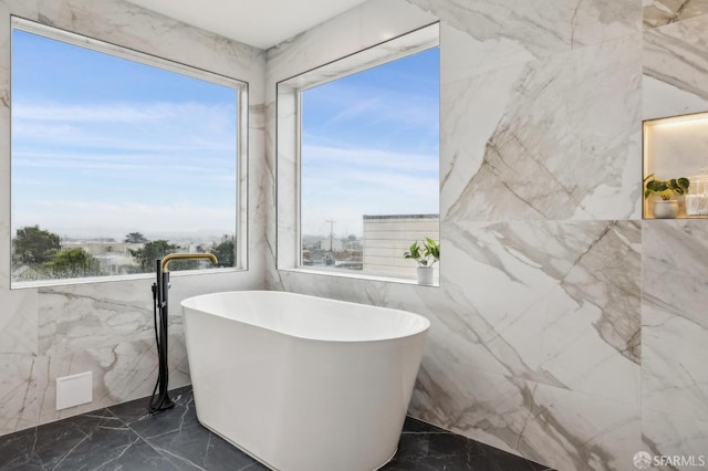 bathroom featuring a washtub