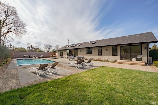 view of pool with a yard and a patio area