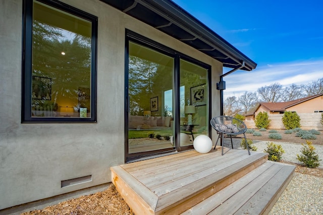 wooden terrace with a patio