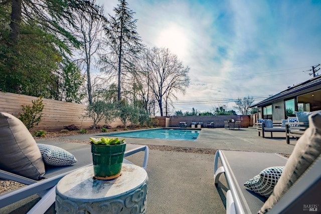 view of pool featuring a patio