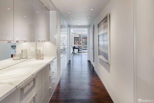 hall with dark hardwood / wood-style floors