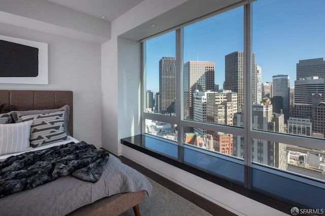 bedroom with hardwood / wood-style flooring