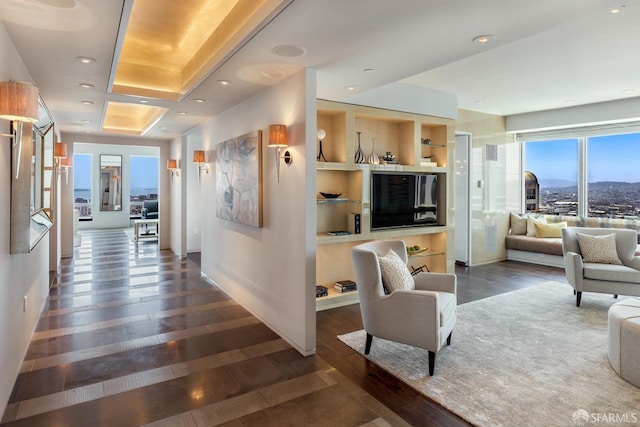 hallway with dark hardwood / wood-style flooring