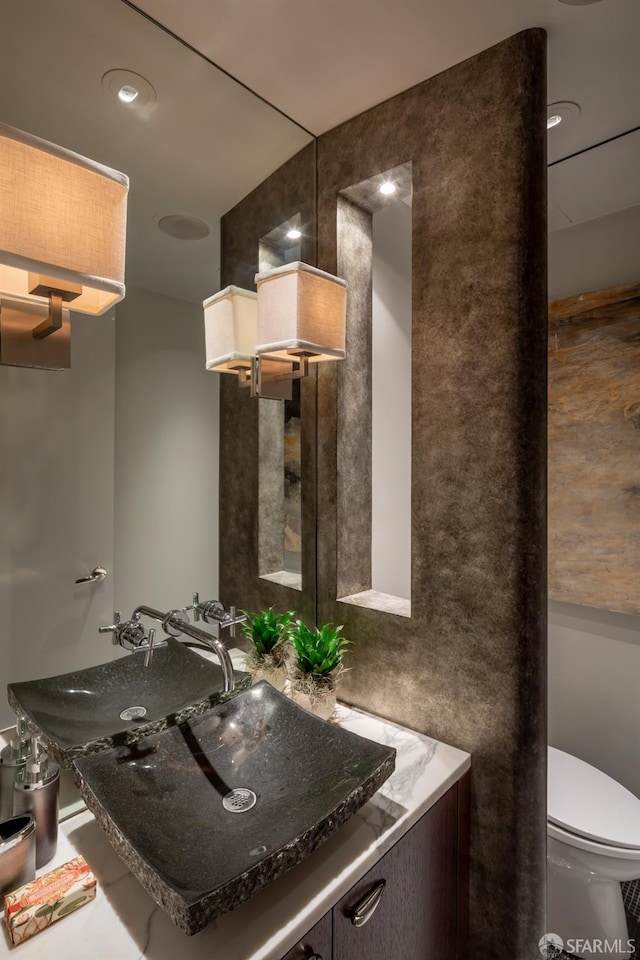 bathroom with vanity and toilet