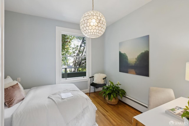 1250 Vallejo St Unit 7, San Francisco, CA 94109 - bedroom featuring a baseboard radiator and wood finished floors