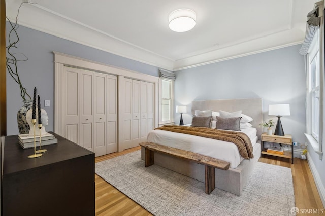 bedroom featuring crown molding and hardwood / wood-style floors