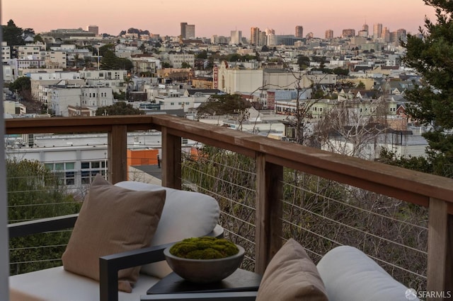 view of balcony at dusk