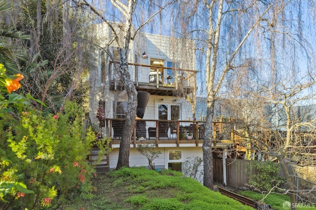 rear view of house with a balcony