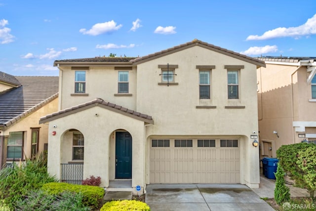 382 Crestview Cir, Daly City, CA 94015 - mediterranean / spanish-style house featuring an attached garage, a tile roof, driveway, and stucco siding