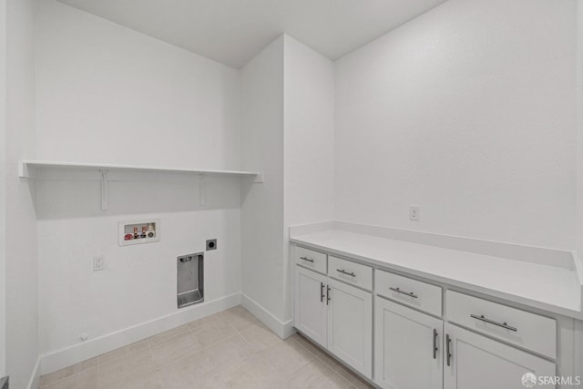 washroom with cabinets, washer hookup, and electric dryer hookup