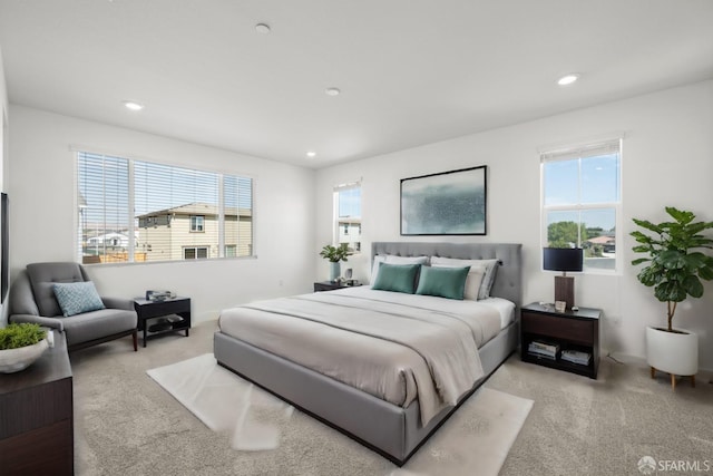 bedroom featuring light colored carpet