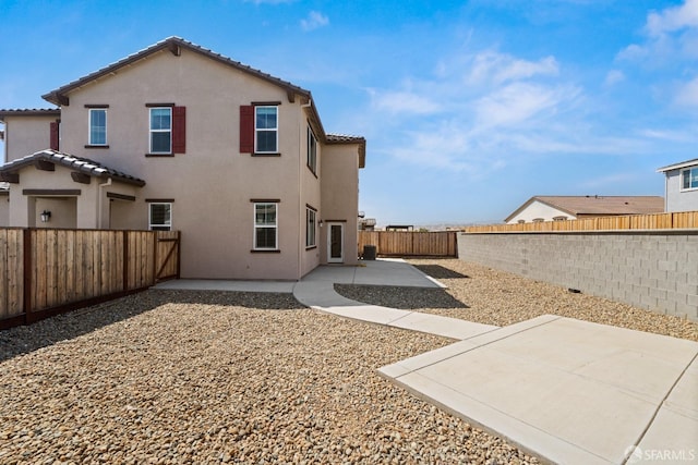 rear view of house featuring a patio area