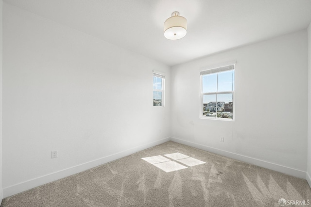 unfurnished room featuring carpet floors