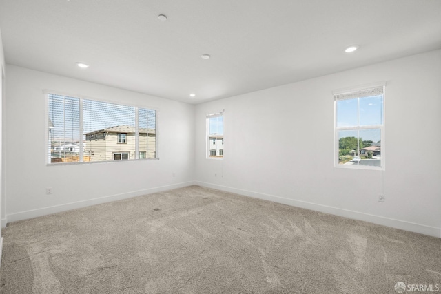 unfurnished room featuring carpet