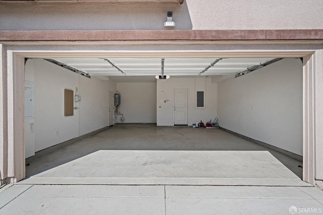 garage with a garage door opener, a carport, and electric panel