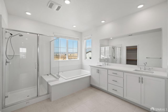 bathroom featuring vanity, tile patterned flooring, and independent shower and bath