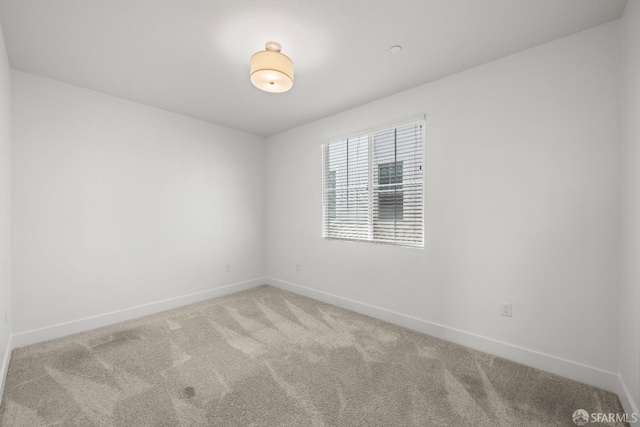 empty room featuring carpet flooring