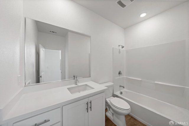 full bathroom featuring vanity, toilet, wood-type flooring, and shower / bathing tub combination