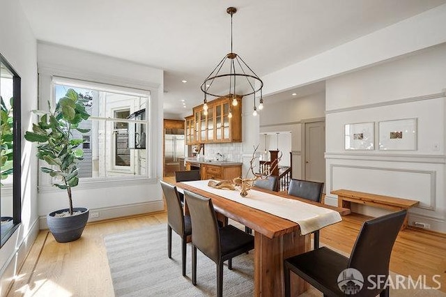 dining space featuring recessed lighting and light wood-style floors
