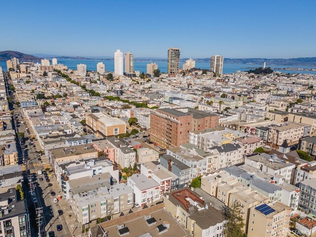 drone / aerial view with a view of city and a water view