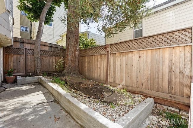 view of yard featuring a patio area and a fenced backyard