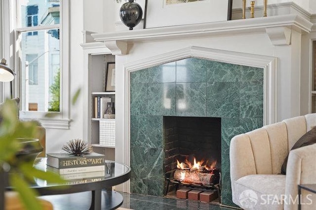 sitting room with a fireplace