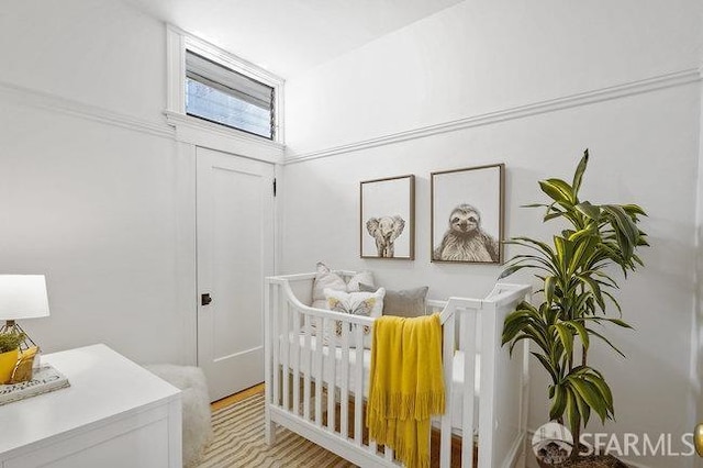 bedroom with a nursery area