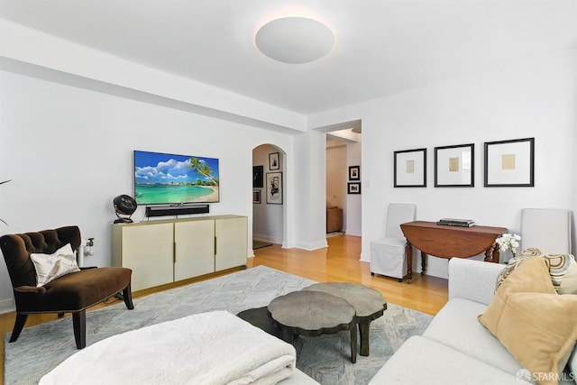 631 Ofarrell St Unit 702, San Francisco, CA 94109 - living area featuring arched walkways and light wood-style flooring