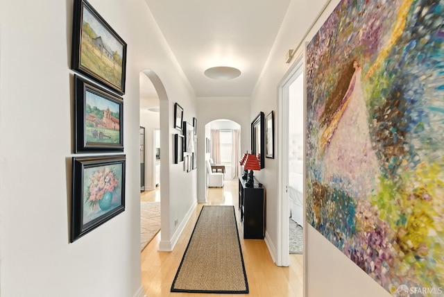 631 Ofarrell St Unit 702, San Francisco, CA 94109 - hall with arched walkways and light wood-style flooring