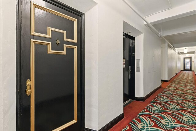 631 Ofarrell St Unit 702, San Francisco, CA 94109 - hall with dark colored carpet and baseboards