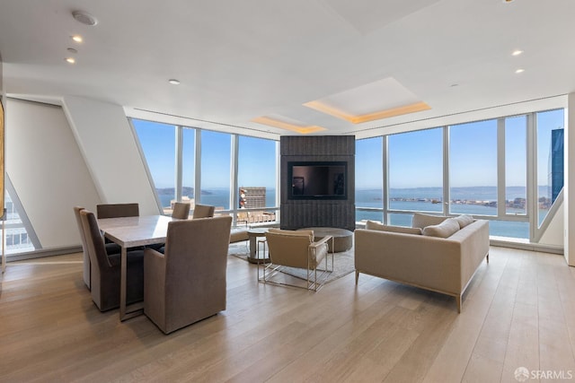181 Fremont St Unit 58A, San Francisco, CA 94105 - living area with expansive windows, light wood-type flooring, and recessed lighting