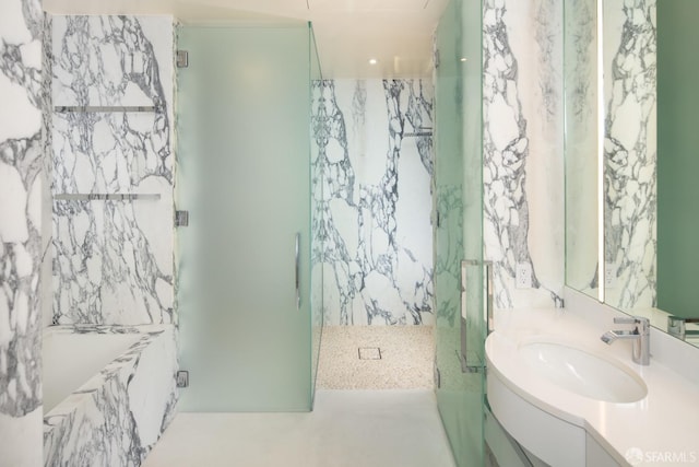 bathroom featuring independent shower and bath, vanity, and tile walls