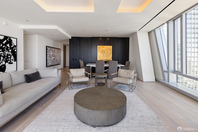 181 Fremont St Unit 58A, San Francisco, CA 94105 - living room featuring wood finished floors and an accent wall