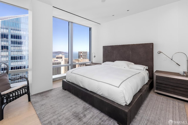 181 Fremont St Unit 58A, San Francisco, CA 94105 - bedroom featuring wood finished floors and a wall of windows