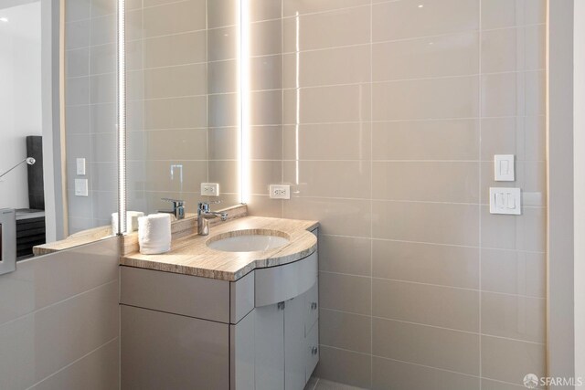 181 Fremont St Unit 58A, San Francisco, CA 94105 - bathroom with vanity and tile walls